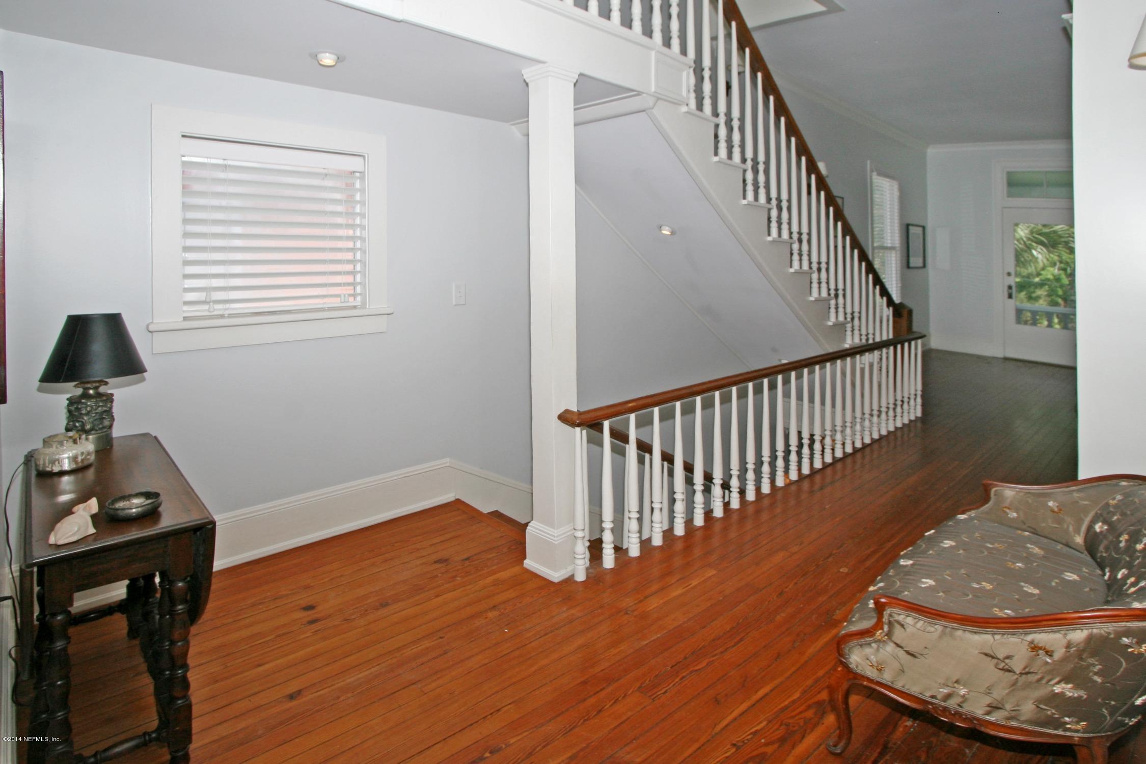 48 Water Street St. Augustine, FL 32084 - Photo 42 of 52 a view of a hallway with wooden floor and stairs