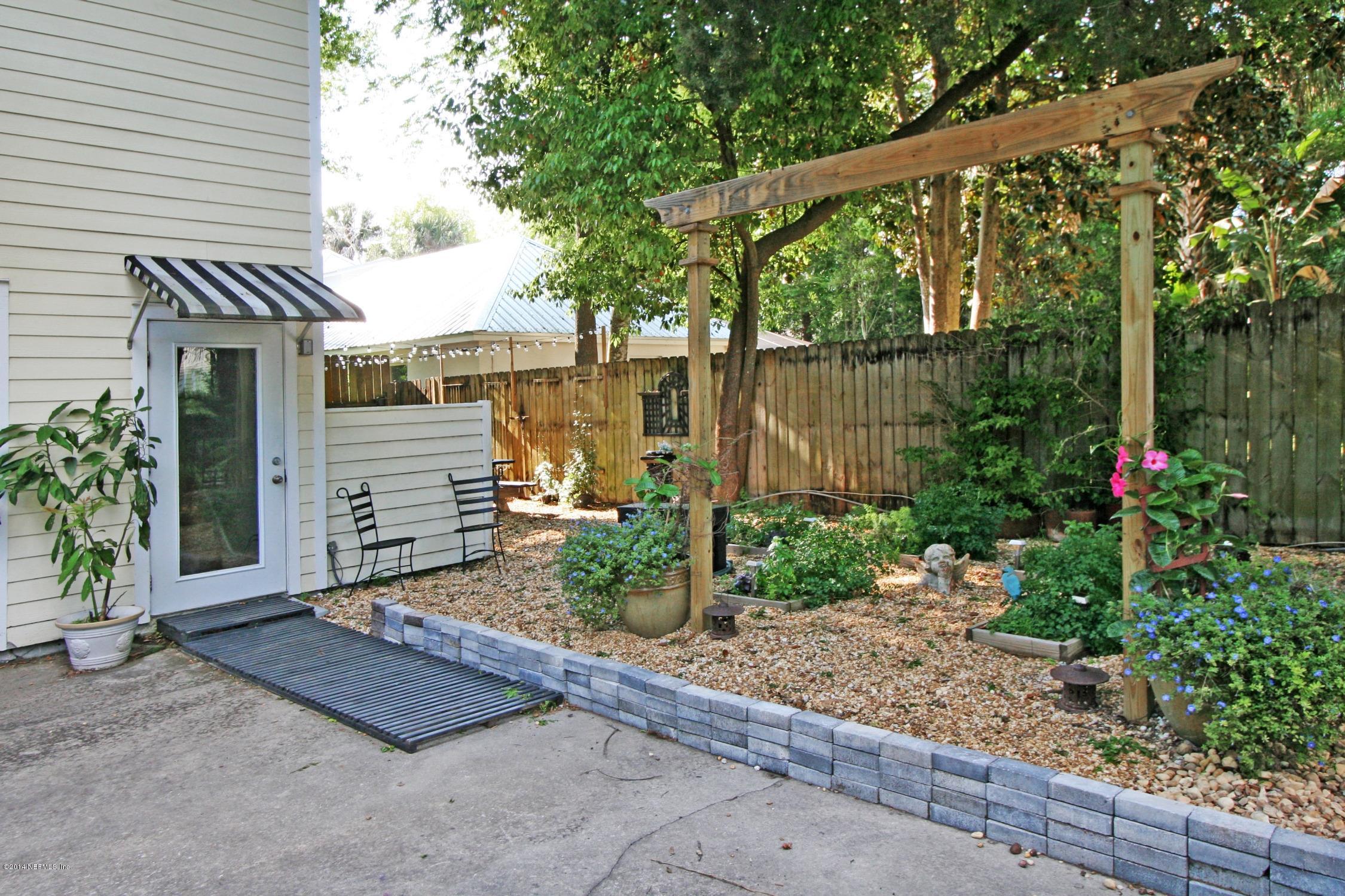 48 Water Street St. Augustine, FL 32084 - Photo 45 of 52 a backyard of a house with plants