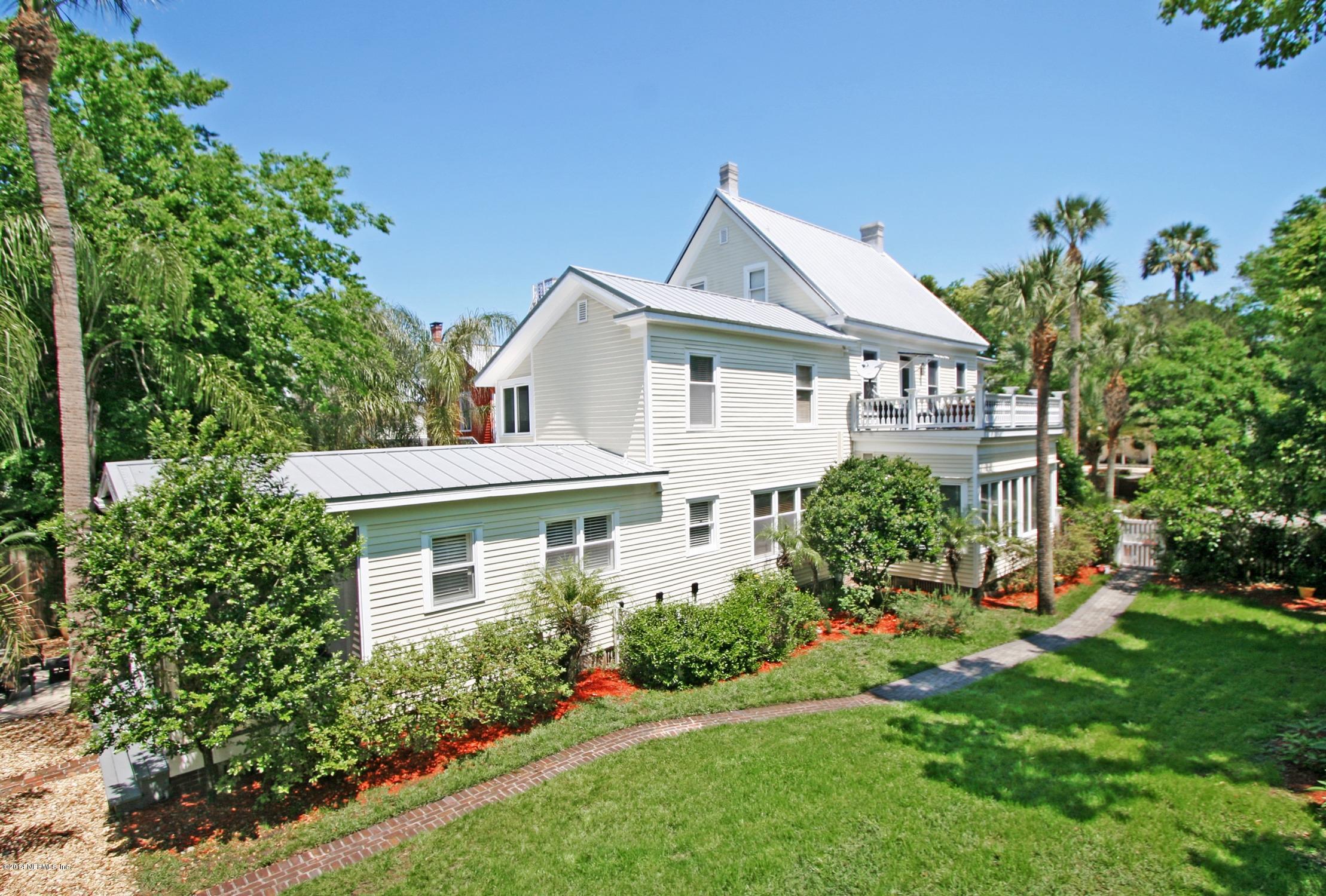 48 Water Street St. Augustine, FL 32084 - Photo 6 of 52 a front view of a house with a yard