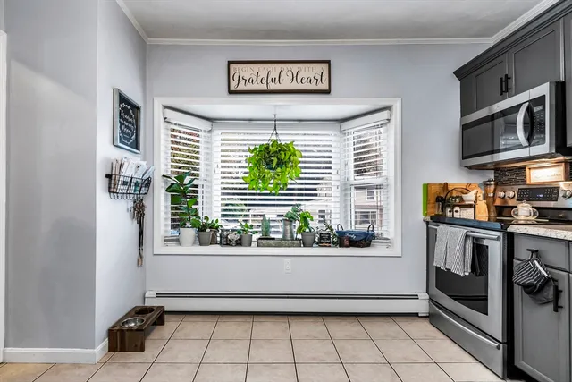 a kitchen with stainless steel appliances a refrigerator and a stove top oven