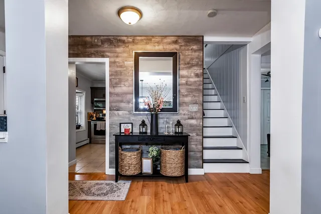 a view of living room with furniture and wooden floor