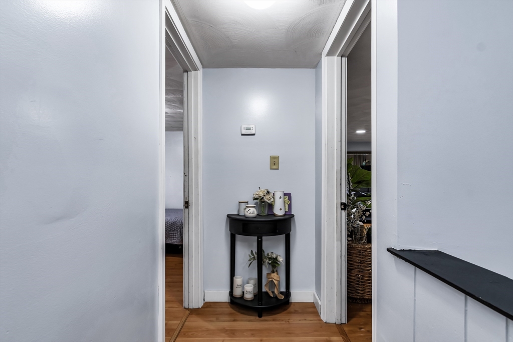 2 Maurice Avenue Lawrence, MA 01841 - Photo 20 of 36 a view of a hallway with wooden floor and living room