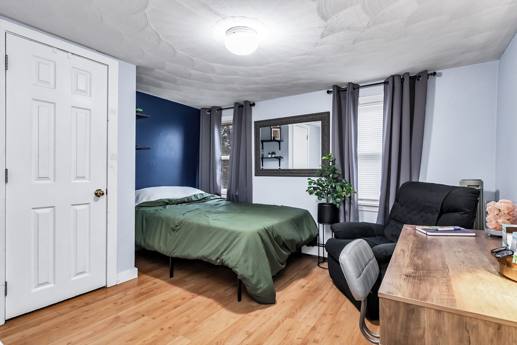 2 Maurice Avenue Lawrence, MA 01841 - Photo 21 of 36 a spacious bedroom with a bed and window