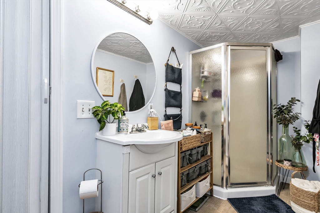 2 Maurice Avenue Lawrence, MA 01841 - Photo 28 of 36 a bathroom with a sink and a mirror