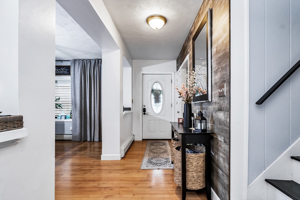 2 Maurice Avenue Lawrence, MA 01841 - Photo 4 of 36 a view of hallway with wooden floor and furniture