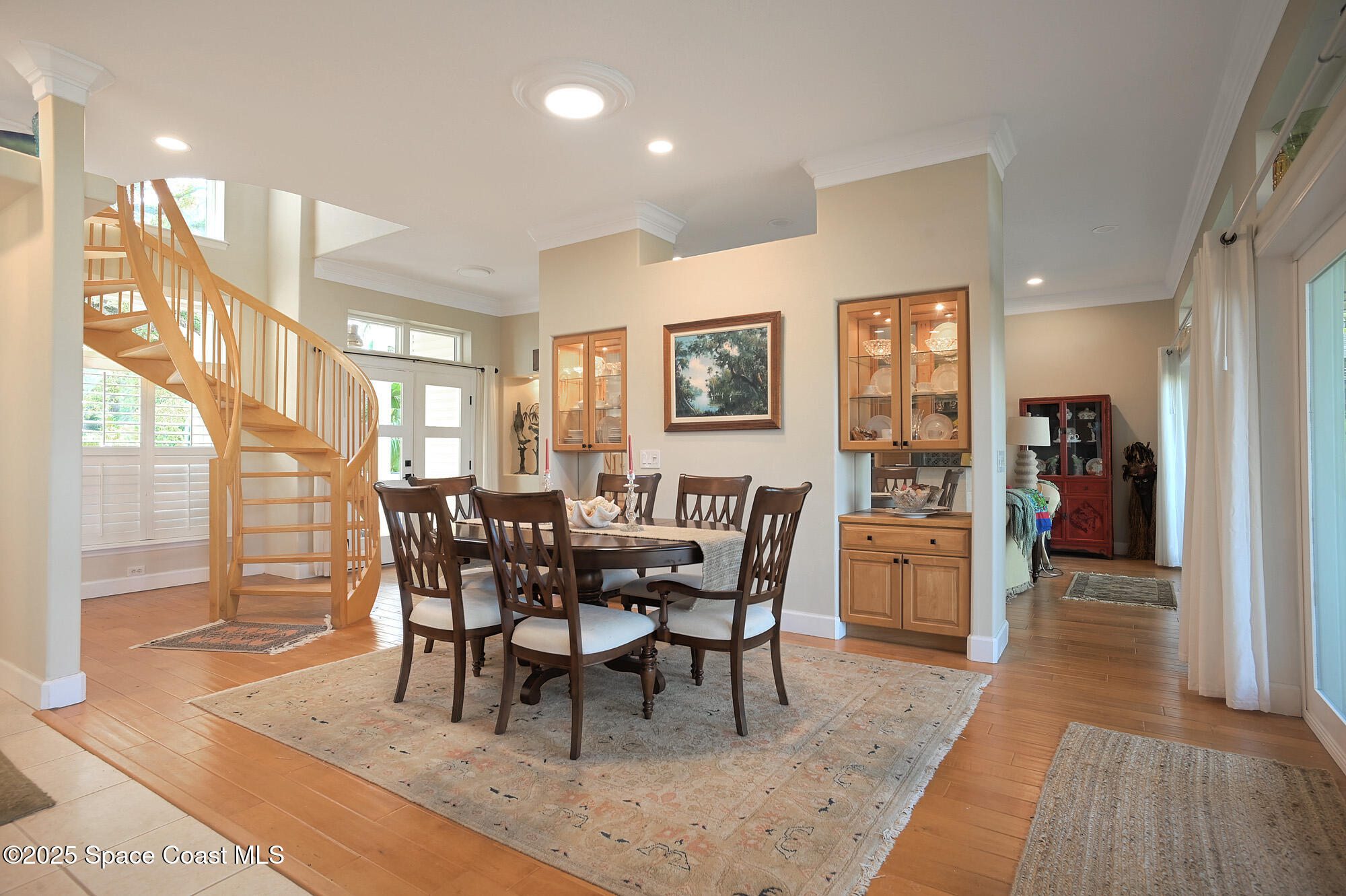 5930 Riverside Drive Melbourne Beach, FL 32951 - Photo 12 of 46 a view of a dining room with furniture and wooden floor