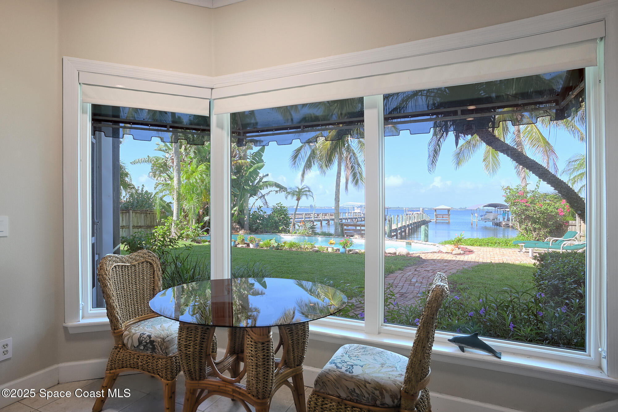 5930 Riverside Drive Melbourne Beach, FL 32951 - Photo 15 of 46 a view of a porch with furniture and garden