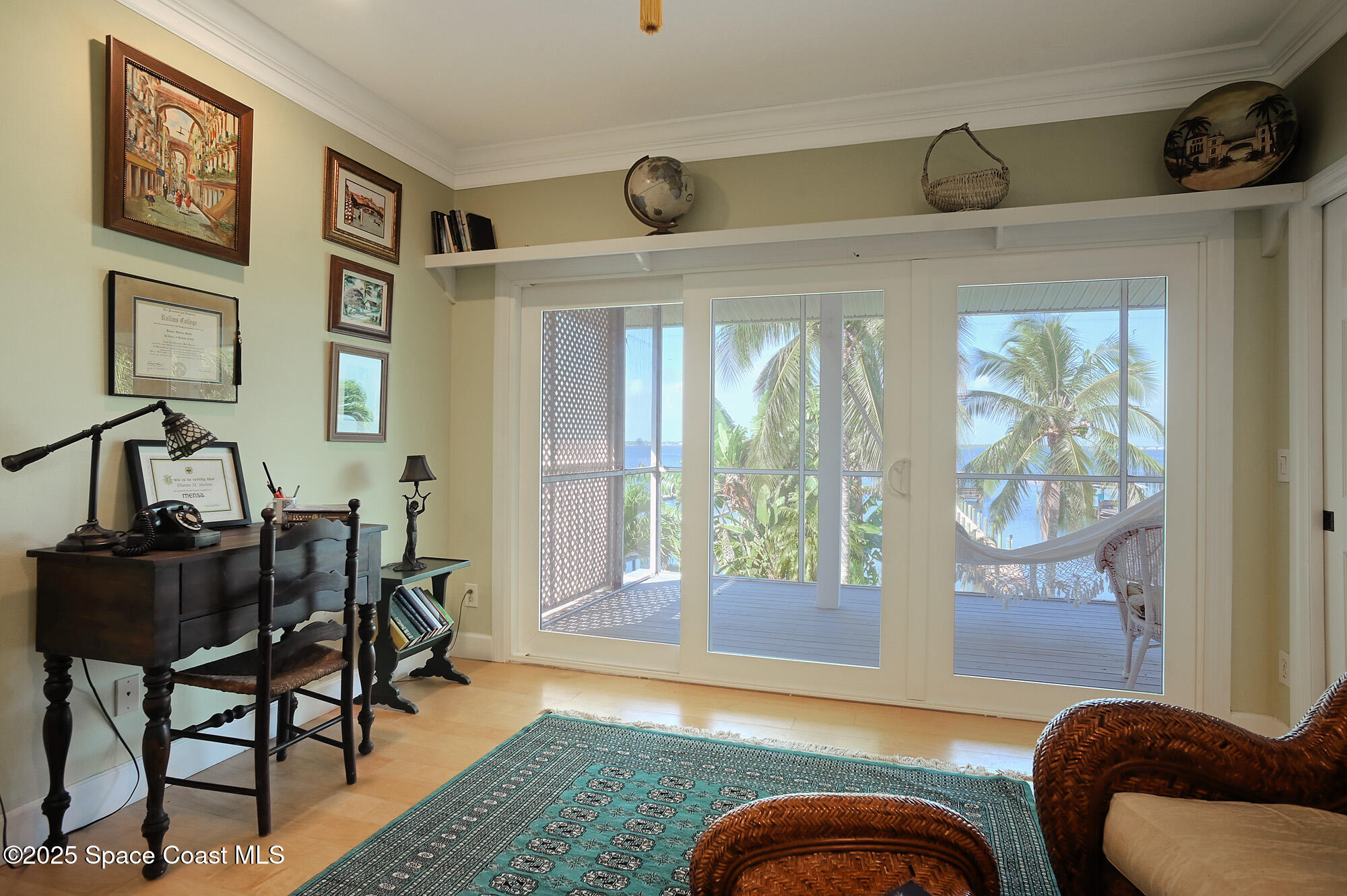 5930 Riverside Drive Melbourne Beach, FL 32951 - Photo 20 of 46 a living room with furniture and a window