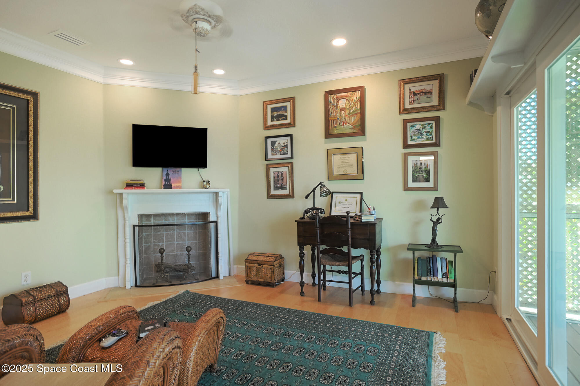 5930 Riverside Drive Melbourne Beach, FL 32951 - Photo 21 of 46 a bedroom with furniture and a flat screen tv
