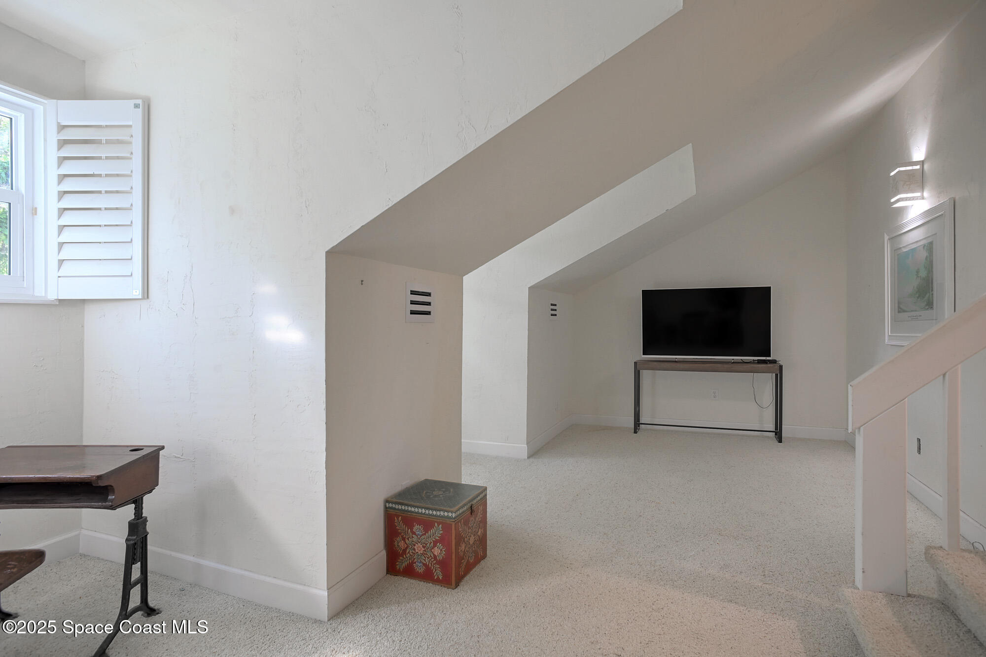 5930 Riverside Drive Melbourne Beach, FL 32951 - Photo 27 of 46 a living room with furniture and a flat screen tv