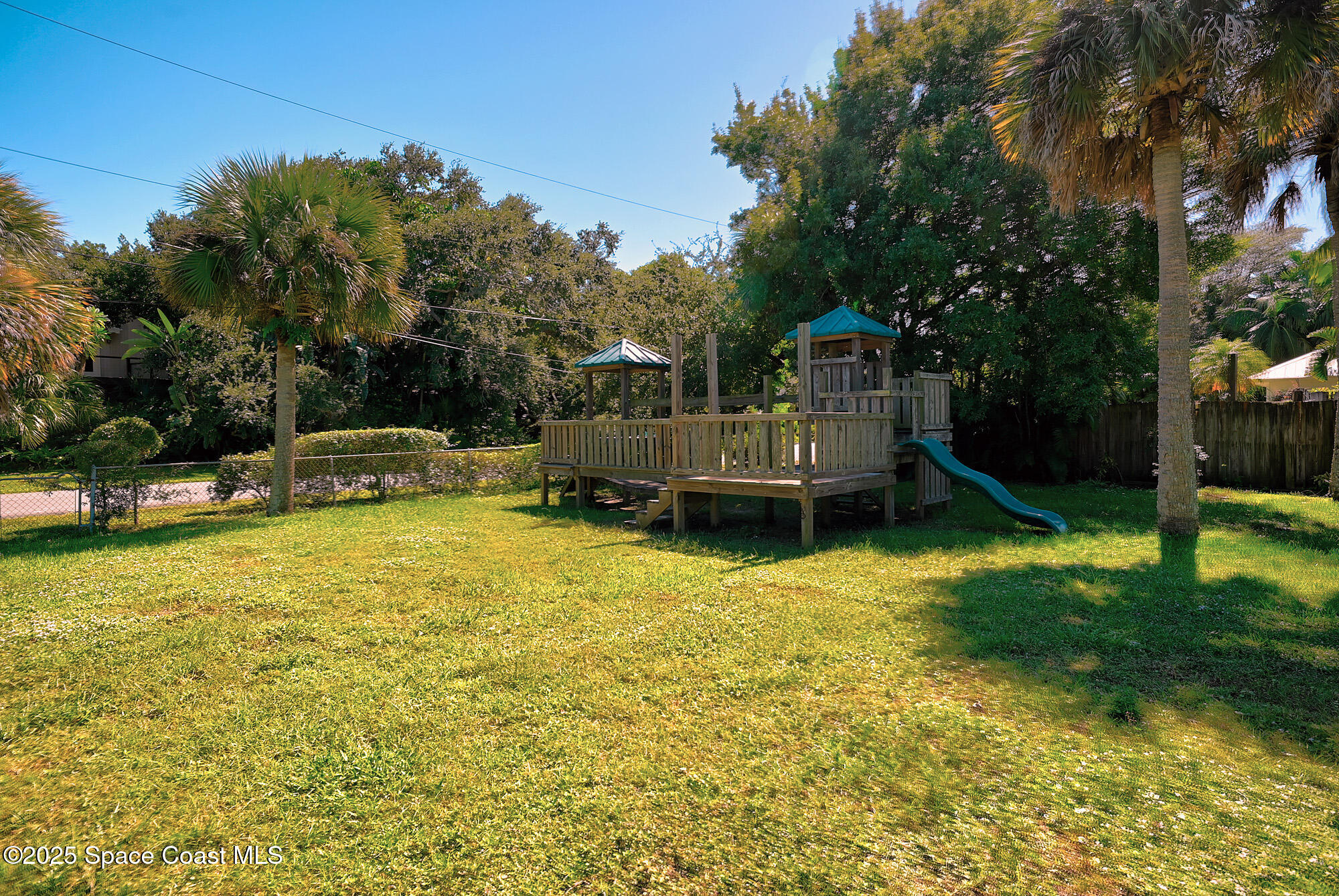 5930 Riverside Drive Melbourne Beach, FL 32951 - Photo 33 of 46 a view of a house with swimming pool and sitting area