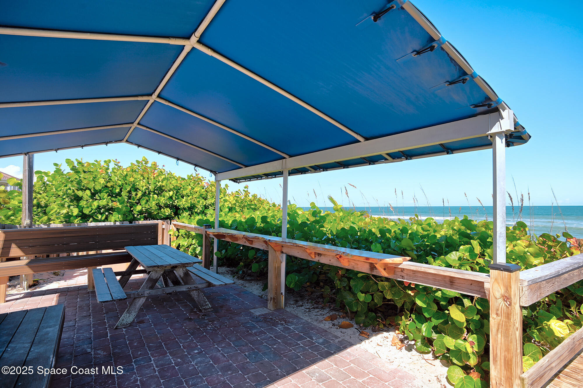 5930 Riverside Drive Melbourne Beach, FL 32951 - Photo 37 of 46 a patio with an outdoor space