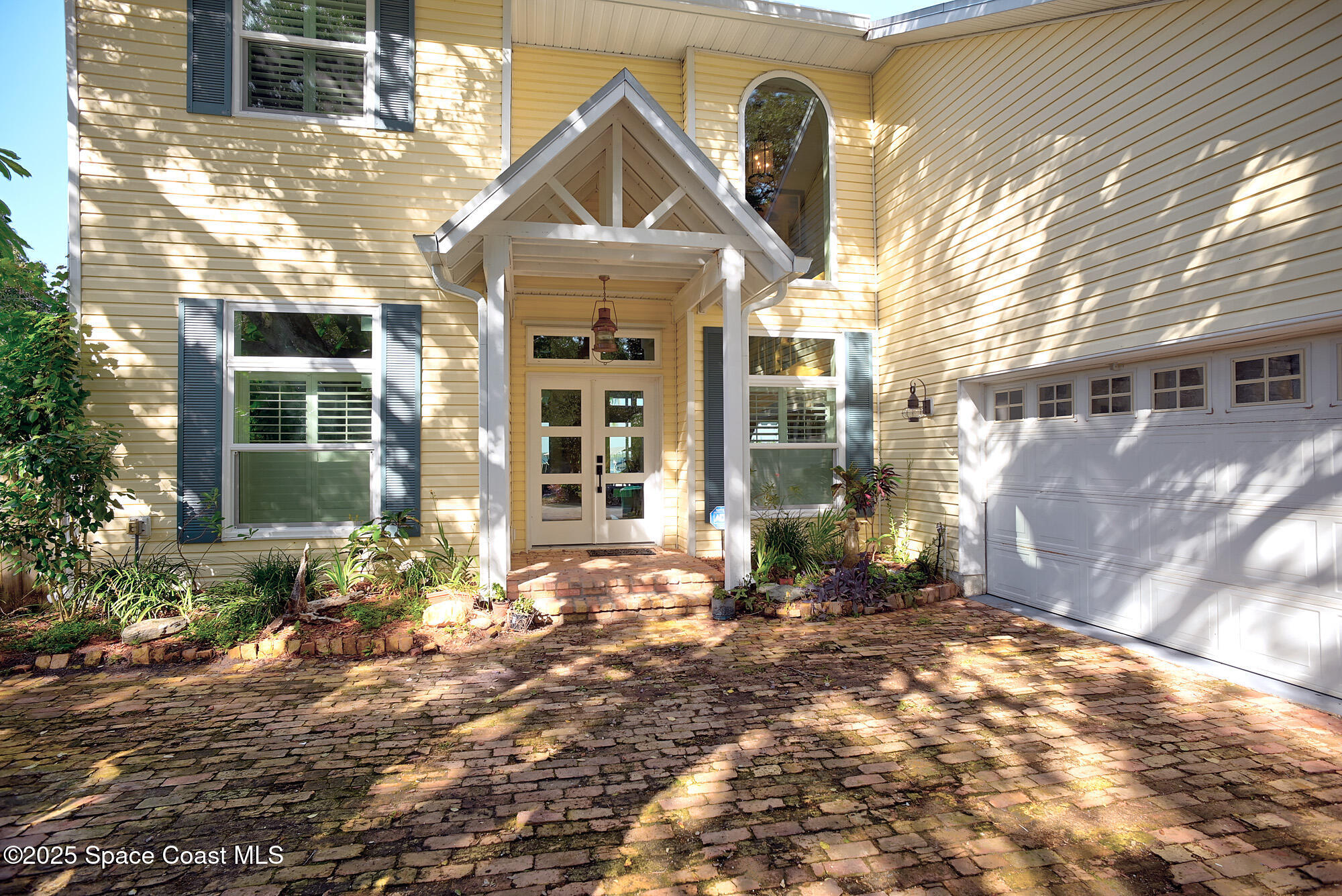 5930 Riverside Drive Melbourne Beach, FL 32951 - Photo 7 of 46 a front view of a house