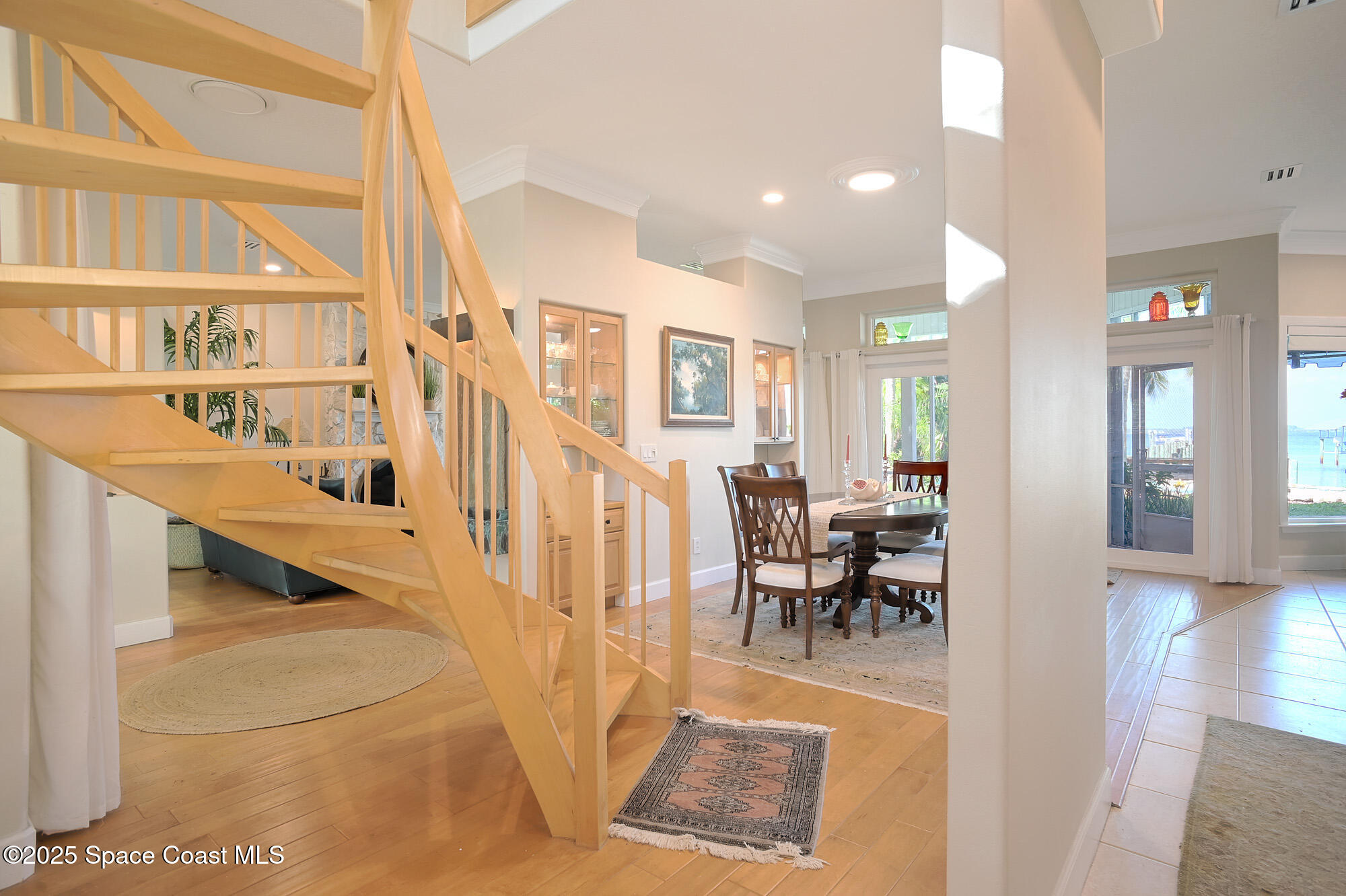 5930 Riverside Drive Melbourne Beach, FL 32951 - Photo 9 of 46 a view of a living room and dining room