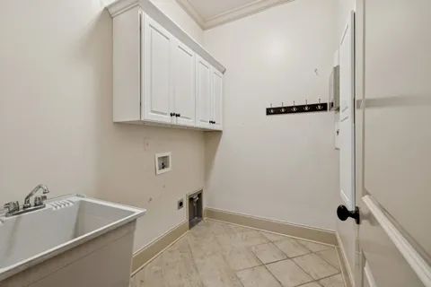 a kitchen with stainless steel appliances a dining table chairs stove and cabinets