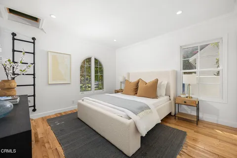 a bed room with a bed and a window