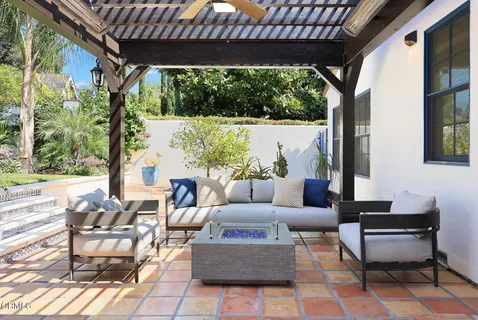 a outdoor space with patio the couches and a dining table with garden view