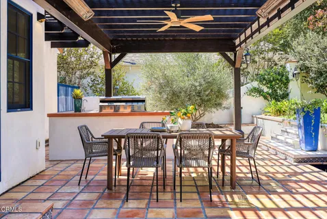 a view of an outdoor dining space with furniture