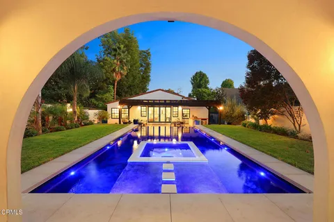 a view of a yard with swimming pool