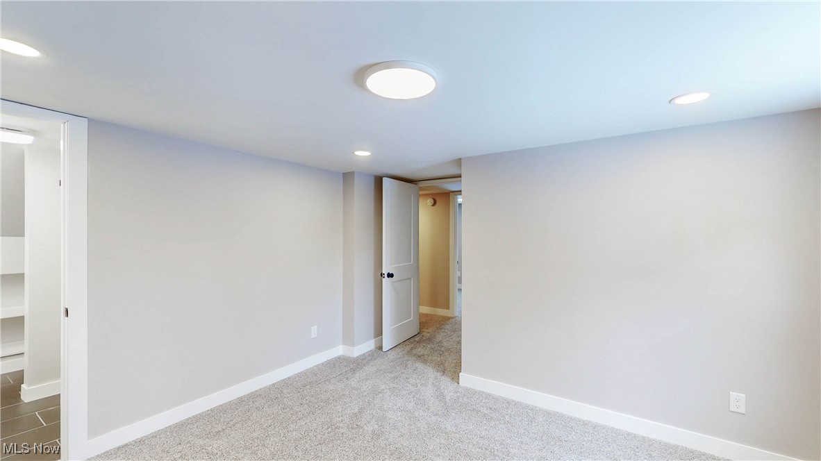 2978 Long Road Uniontown, OH 44685 - Photo 30 of 40 Below grade area featuring recessed lighting and light carpet