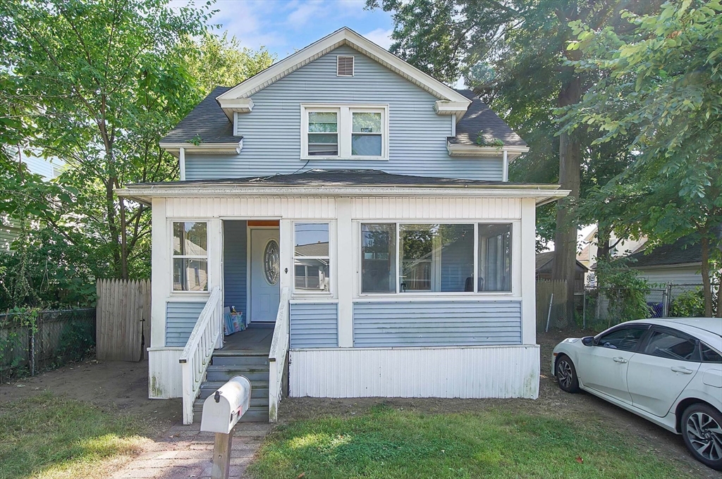 a view of a house with a yard