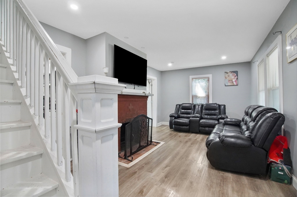 15 Eldert Street Springfield, MA 01109 - Photo 11 of 28 a living room with furniture and a flat screen tv