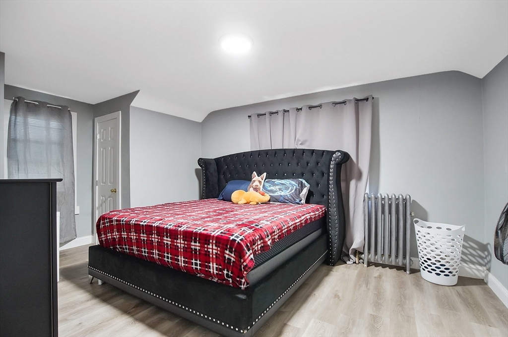 15 Eldert Street Springfield, MA 01109 - Photo 15 of 28 a bedroom with a bed and a window