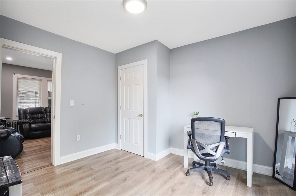 15 Eldert Street Springfield, MA 01109 - Photo 18 of 28 a view of a workspace with wooden floor and a bathroom