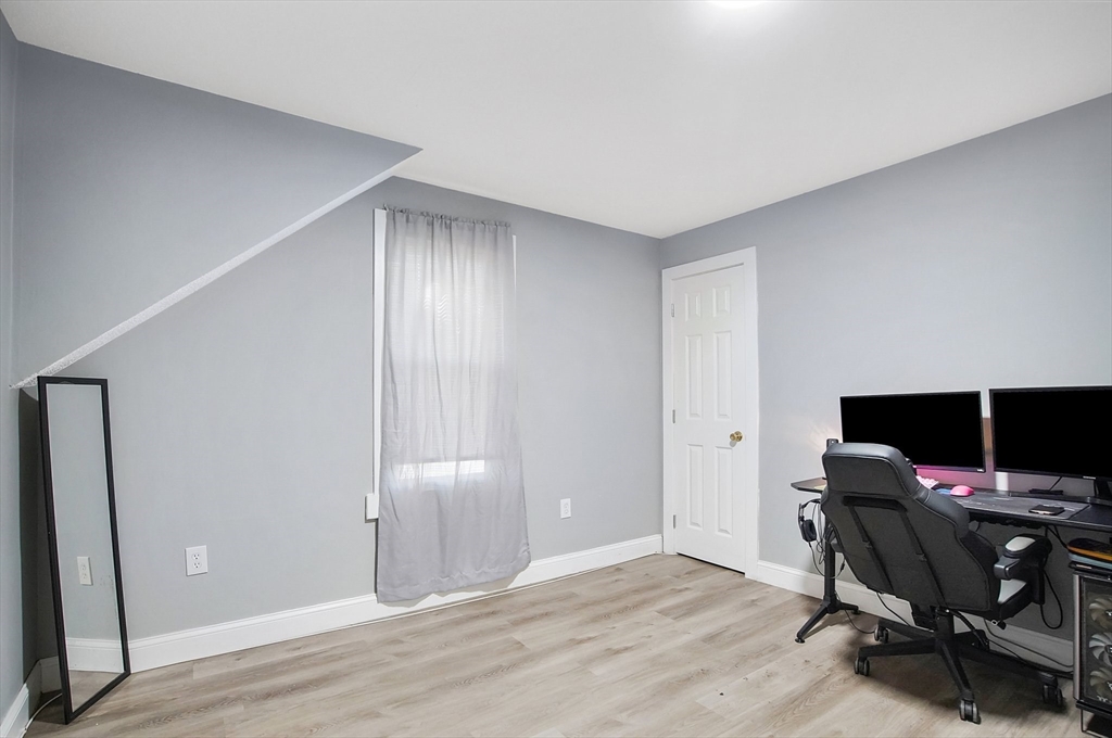 15 Eldert Street Springfield, MA 01109 - Photo 19 of 28 a view of a workspace with furniture and wooden floor