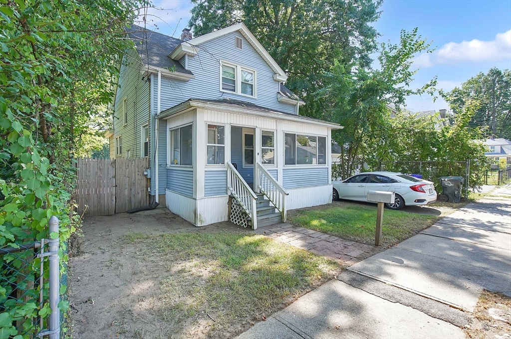 15 Eldert Street Springfield, MA 01109 - Photo 2 of 28 a view of a white house and a large tree in front of a house