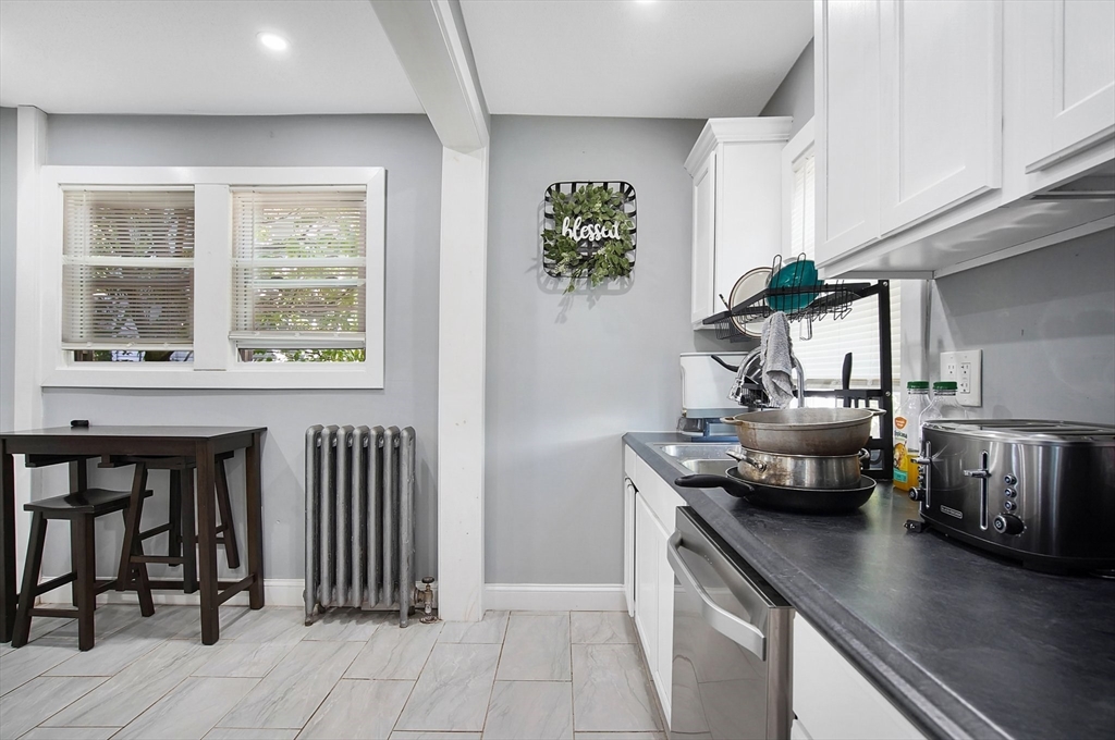 15 Eldert Street Springfield, MA 01109 - Photo 7 of 28 a kitchen with a sink and a stove top oven