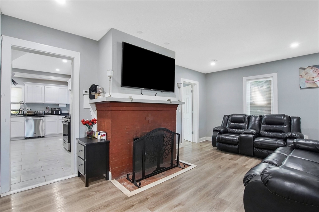 15 Eldert Street Springfield, MA 01109 - Photo 9 of 28 a living room with furniture and a flat screen tv