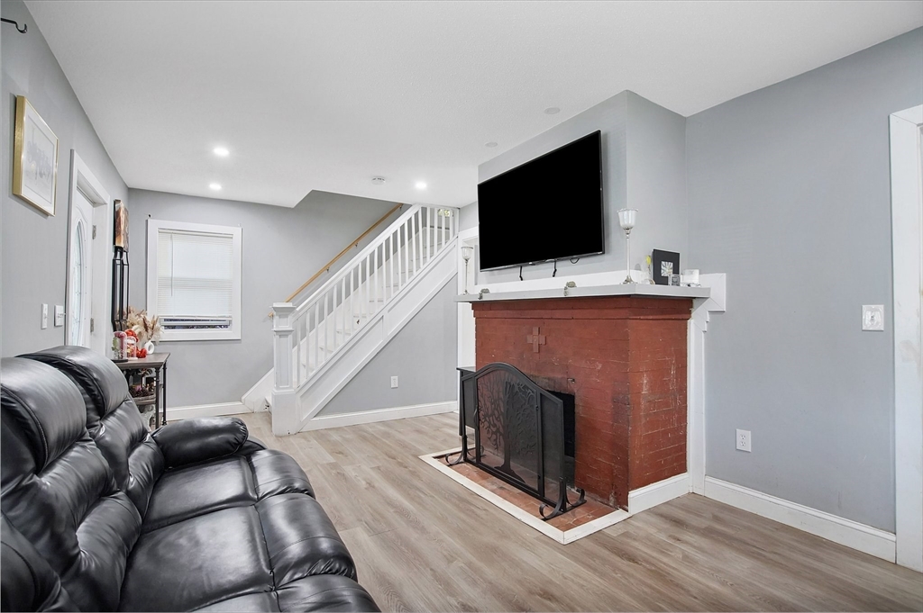 15 Eldert Street Springfield, MA 01109 - Photo 10 of 28 a living room with furniture and a flat screen tv