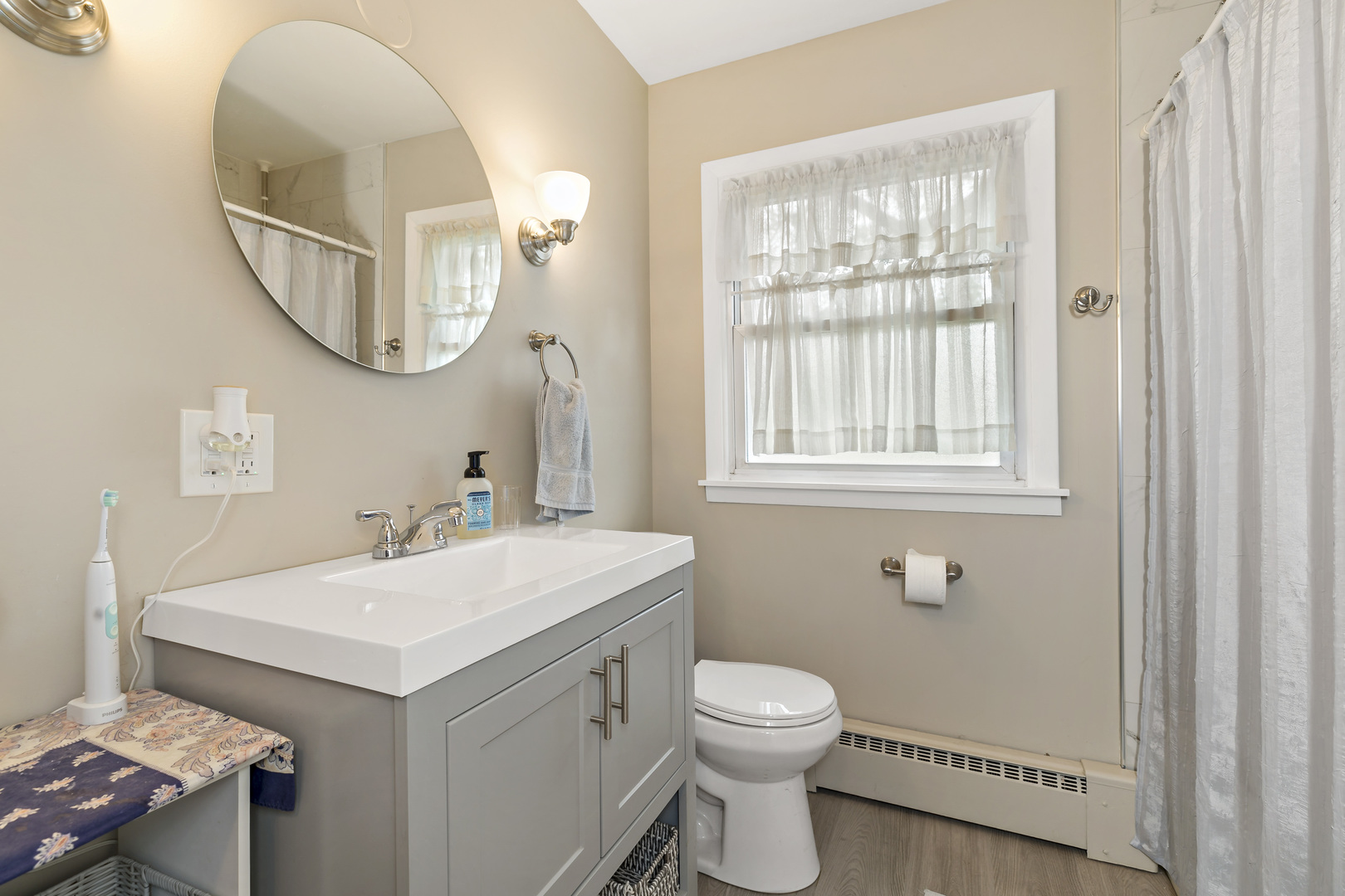 17905 Ridgewood Avenue Lansing, IL 60438 - Photo 12 of 18 a bathroom with a sink a toilet and a mirror