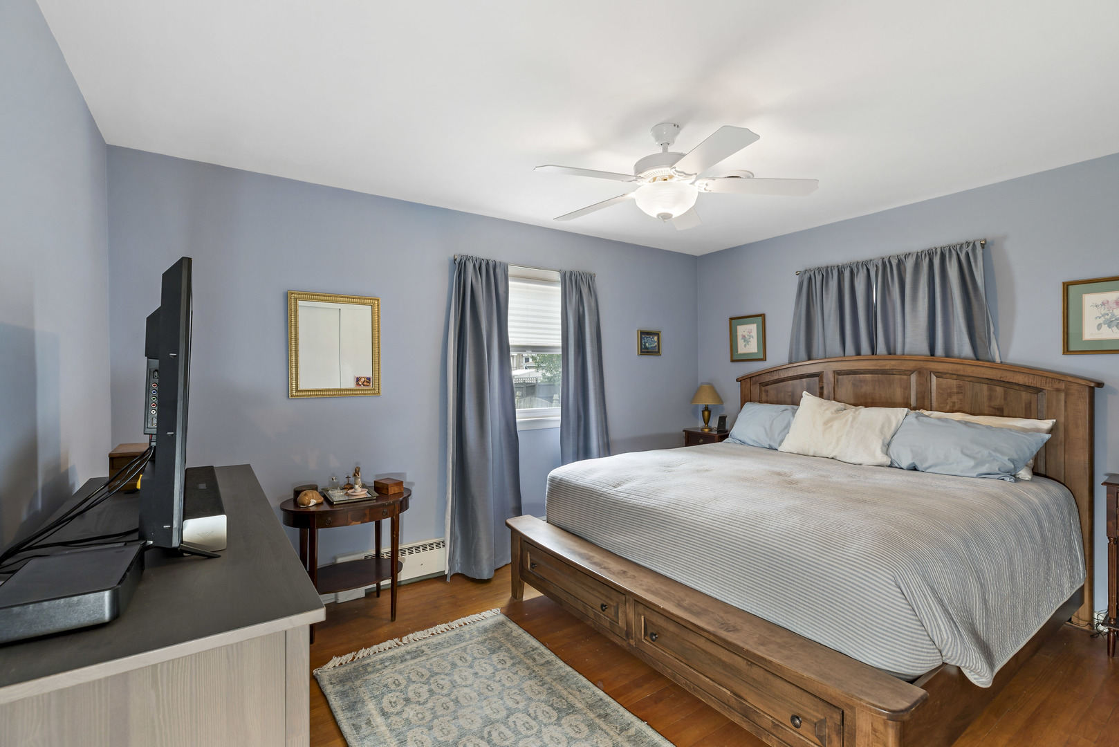 17905 Ridgewood Avenue Lansing, IL 60438 - Photo 14 of 18 a bedroom with a bed and a chandelier