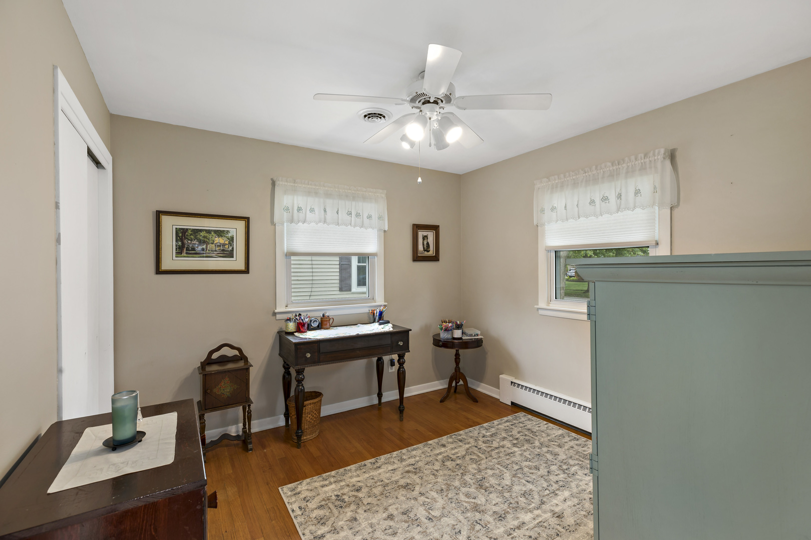 17905 Ridgewood Avenue Lansing, IL 60438 - Photo 15 of 18 a workspace with wooden floor and a chandelier