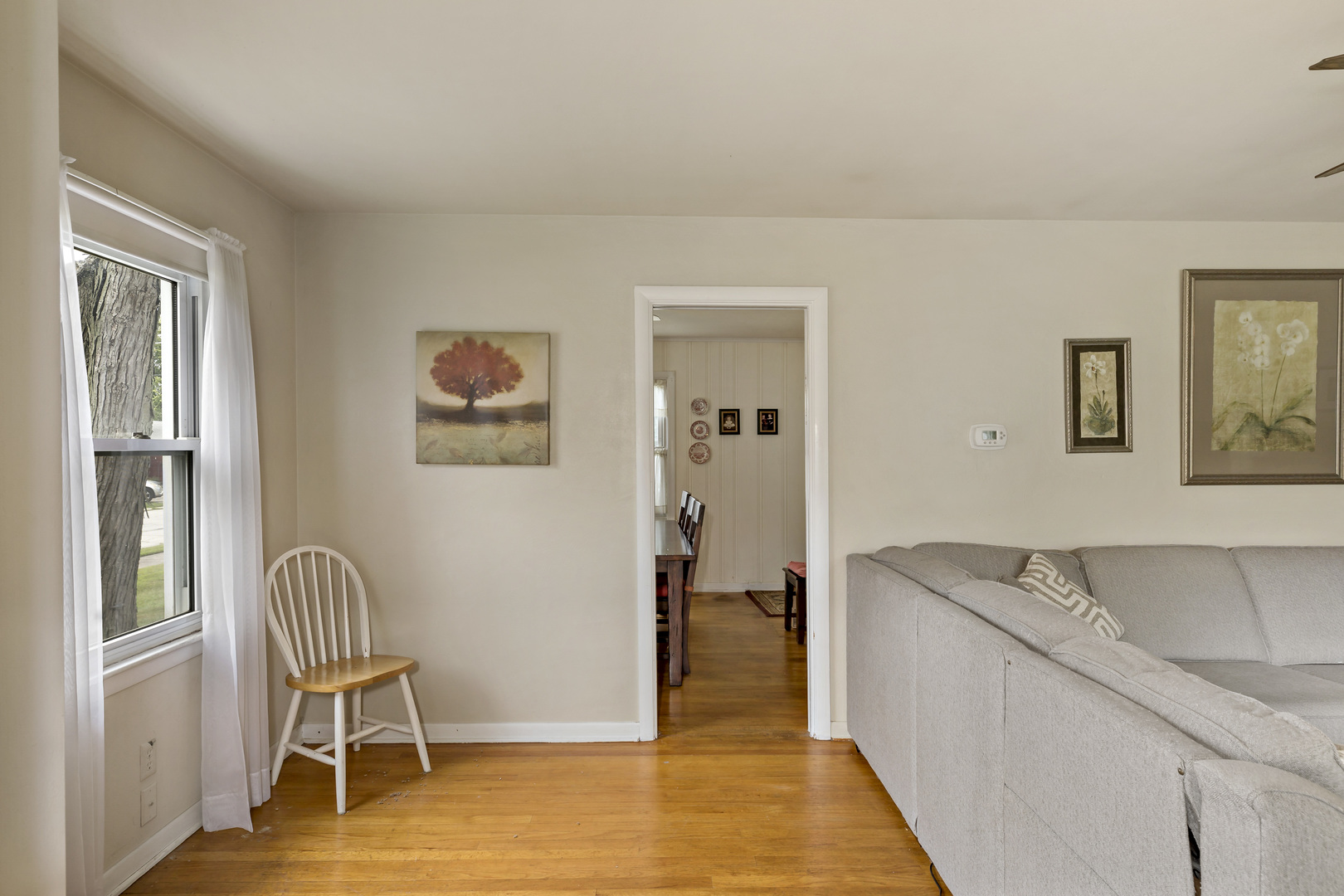 17905 Ridgewood Avenue Lansing, IL 60438 - Photo 6 of 18 a living room with furniture and a chair