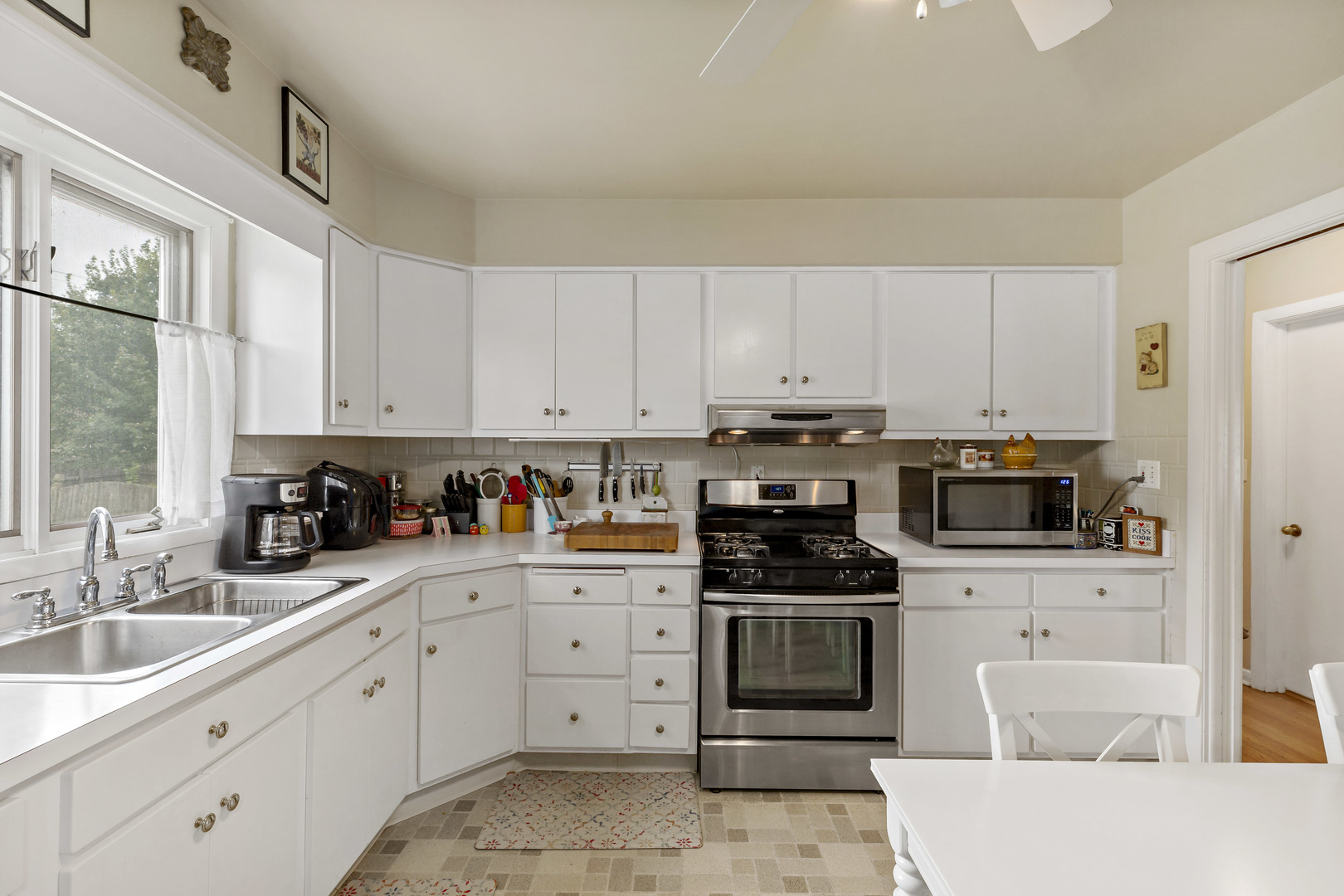 17905 Ridgewood Avenue Lansing, IL 60438 - Photo 7 of 18 a kitchen with cabinets stainless steel appliances and a sink