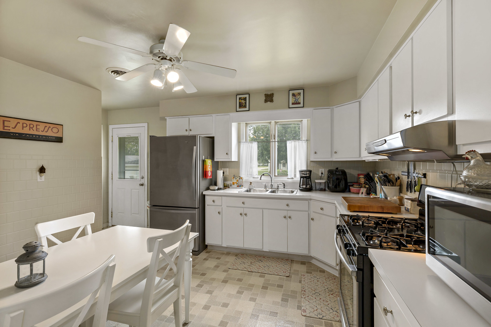 17905 Ridgewood Avenue Lansing, IL 60438 - Photo 8 of 18 a kitchen with granite countertop a refrigerator stove top oven and sink
