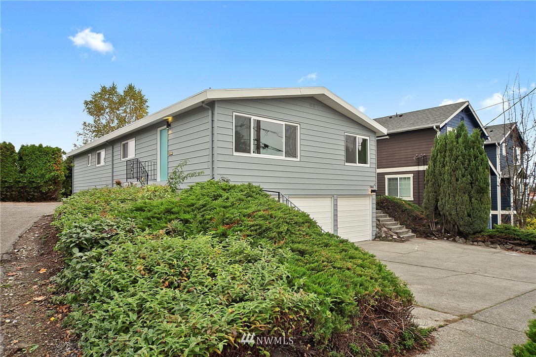 742 North 92nd Street Seattle, WA 98103 - Photo 2 of 16 a view of a house with a yard