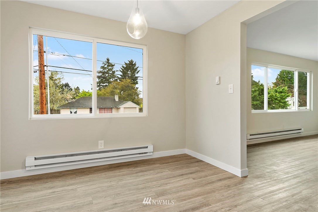 742 North 92nd Street Seattle, WA 98103 - Photo 12 of 16 a view of a small space with wooden floor and a window