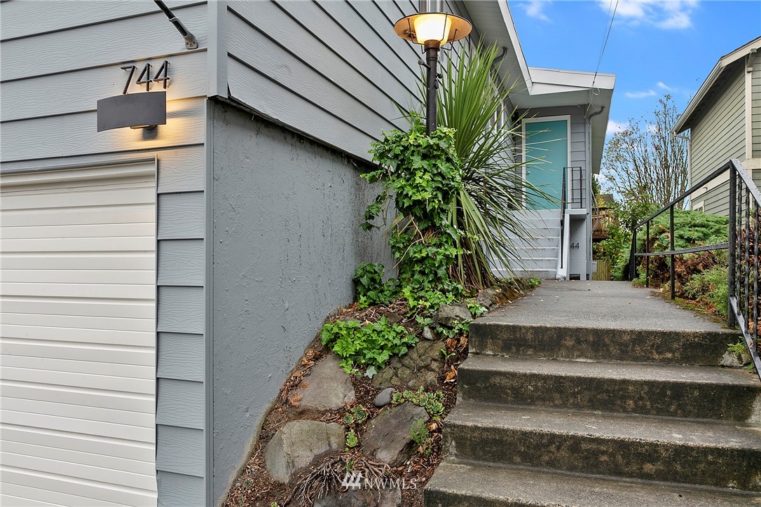 742 North 92nd Street Seattle, WA 98103 - Photo 4 of 16 a view of a house with a potted plant