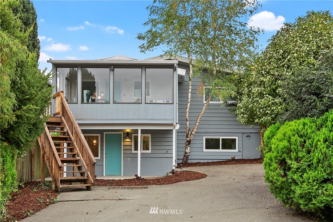 742 North 92nd Street Seattle, WA 98103 - Photo 5 of 16 a front view of a house with a garden