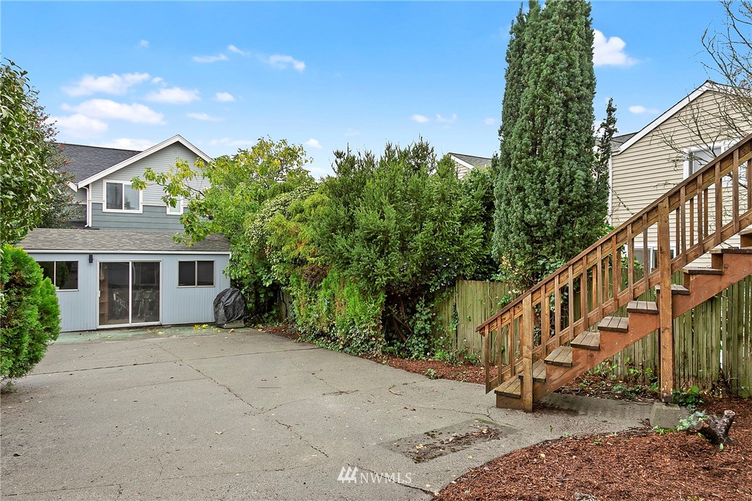 742 North 92nd Street Seattle, WA 98103 - Photo 6 of 16 a view of a house with a yard