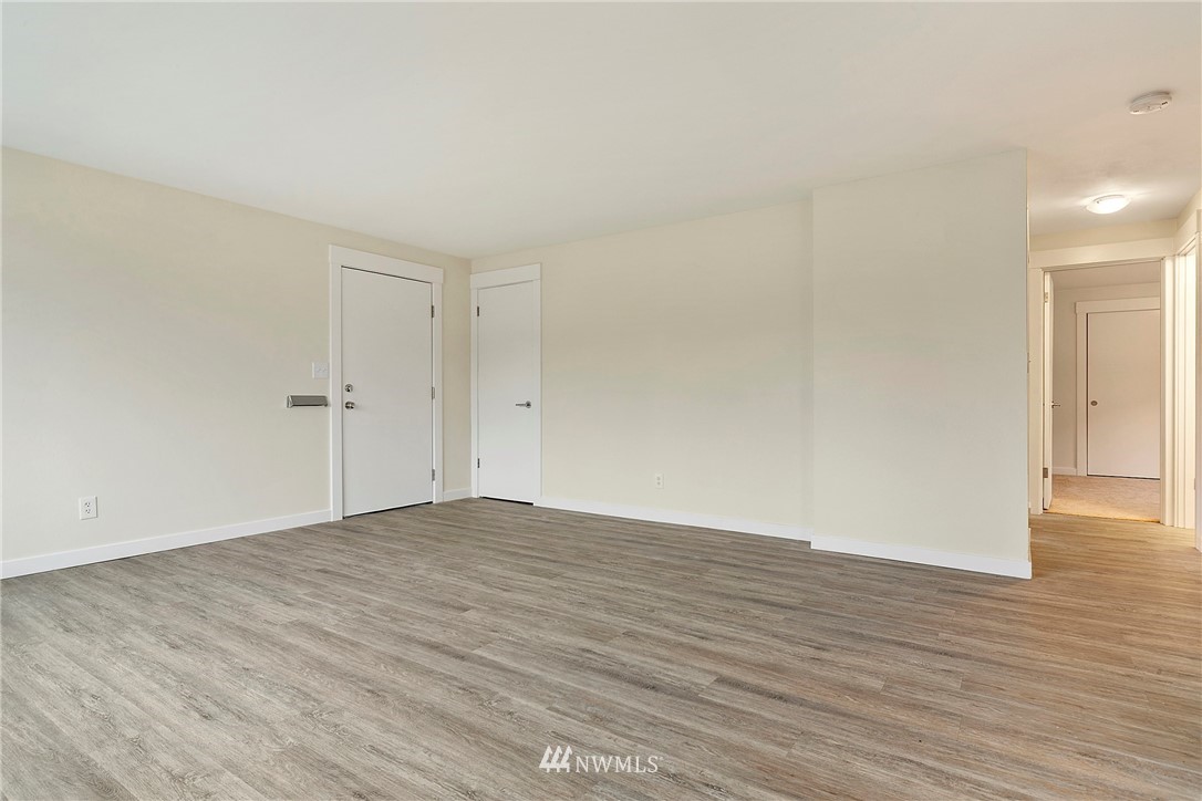 742 North 92nd Street Seattle, WA 98103 - Photo 7 of 16 a view of an empty room with wooden floor