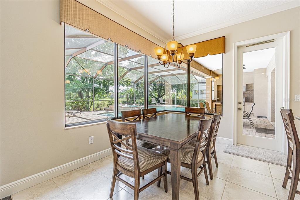 20411 Lace Cascade Road Land O Lakes, FL 34637 - Photo 12 of 44 a view of a dining room with furniture window and outside view