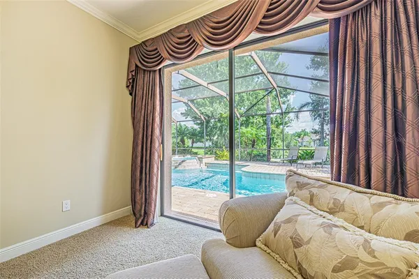 a view of a room that has a bed and a window