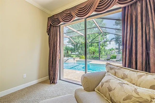 a view of a room that has a bed and a window