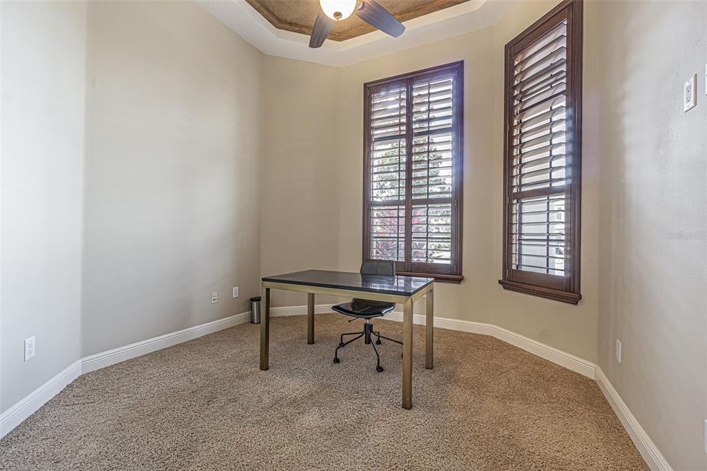 20411 Lace Cascade Road Land O Lakes, FL 34637 - Photo 30 of 44 a view of a workspace with furniture and a window