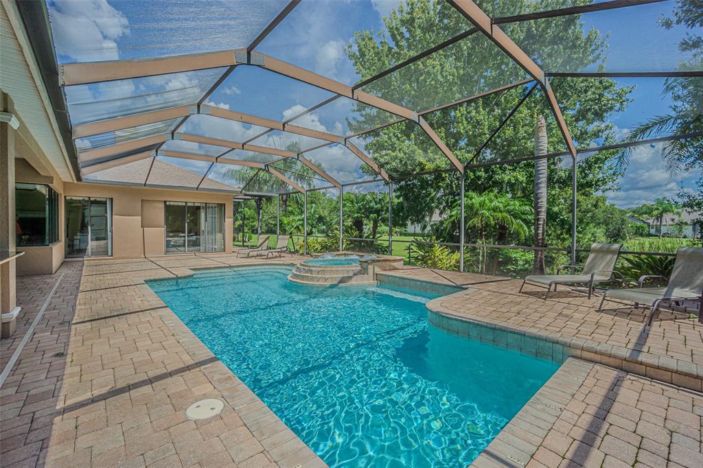 20411 Lace Cascade Road Land O Lakes, FL 34637 - Photo 3 of 44 a view of a backyard with porch